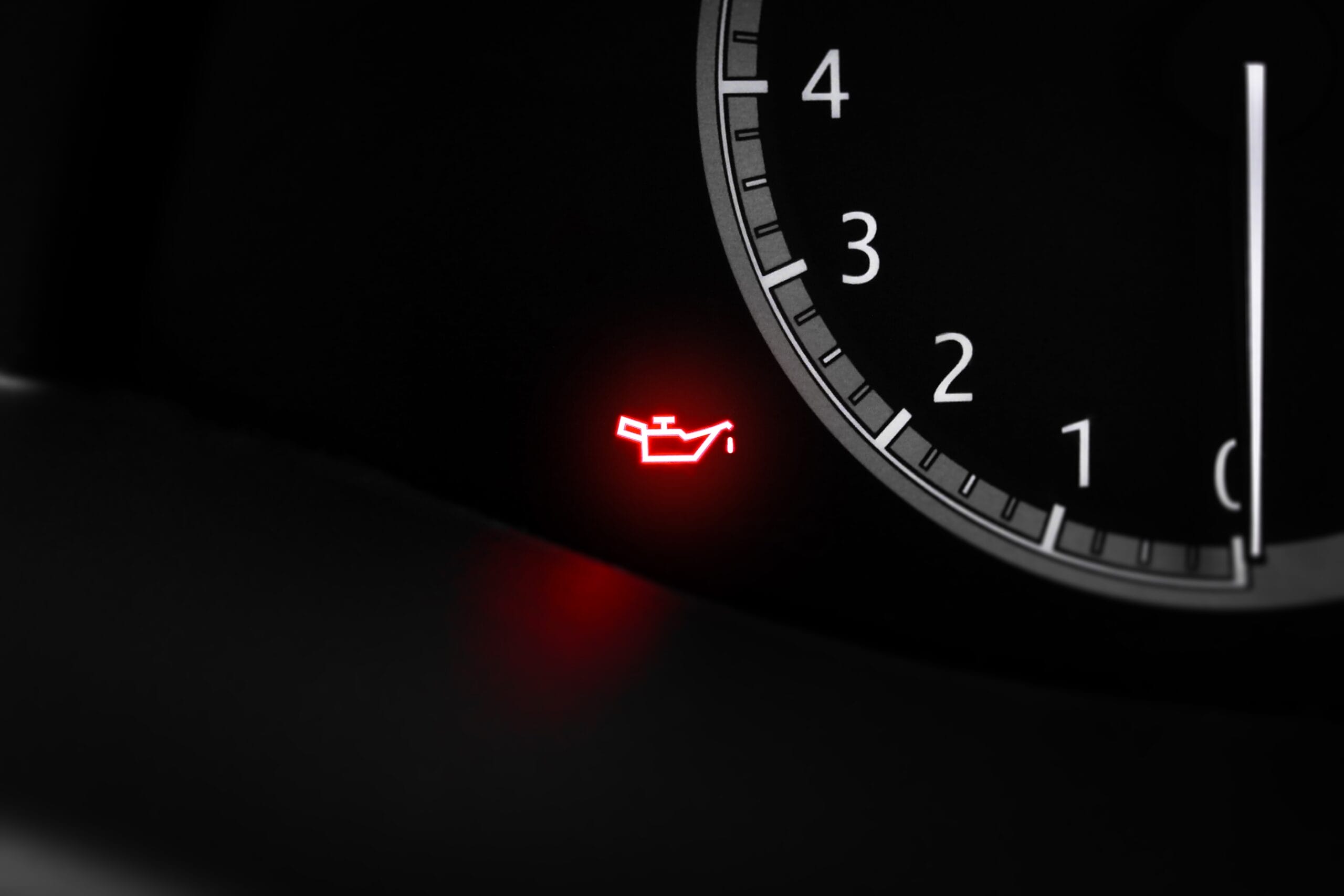 low oil pressure warning light illuminated on dashboard